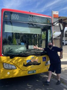 CDC Staff Standing In Front Of A CDC Mildura Bus With Movember Moustaches